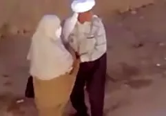 Adult woman in boots spreads her legs and fucks with sex machine