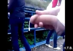 Russian naked guys and girls are swimming in the river