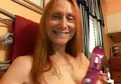 A father and son are banging a brunette in the bedroom