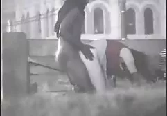 A pumped up dwarf chpoknul plump chick on a leather sofa