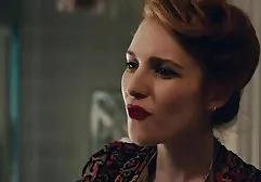 Woman with big tits riding a rubber phallus