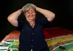 Beautiful mulatto spreads her slim legs and shoves her fingers in hot pussy