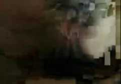 A woman in a leather suit put an enema in her ass and pressed a vibrator to her pussy