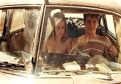 Blonde fingering pussy on a leather sofa