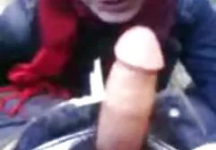 Brunette playing with a dildo in front of her husband