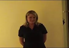 Busty brunette in stockings posing on camera