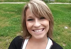 Girl in heels caresses the cap in the middle of the street