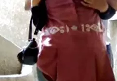 Larisa comes out of the water and removes wet swimsuit