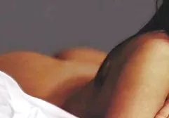 Sexy girl wipes herself with oil and gently caresses