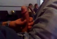 Young gay guy lies on a couch in the doctor's office and enjoys handjob