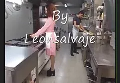 Dozens of naked tourists sunbathe on a nudist beach