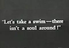 A couple of nudists settling on the beach