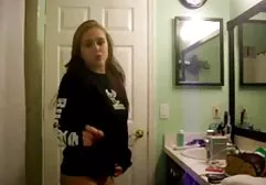 Sexy girl throws slender legs behind her head and masturbates her pussy