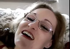 The girl in a frank swimsuit poses for the photographer