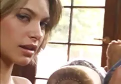 Pretty woman dresses after a shower and talks to her fiance