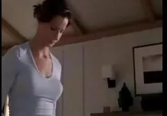 Two slender girls walk through the woods naked