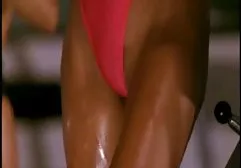 Chick in latex masturbates huge dildo