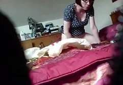 A mother with big boobs tumbles in bed with her skinny son