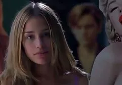 Teen girl sparkles with bare charms in front of the teacher