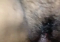 Busty brunette in stockings shows her shaved cunt with big clit