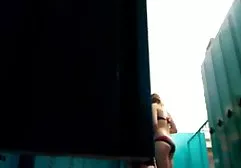 Kira touches her naked body in the shower.