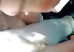 Red-haired wife in a hat makes her husband a blowjob