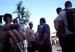 German woman in a pink wig, man frying in the ass